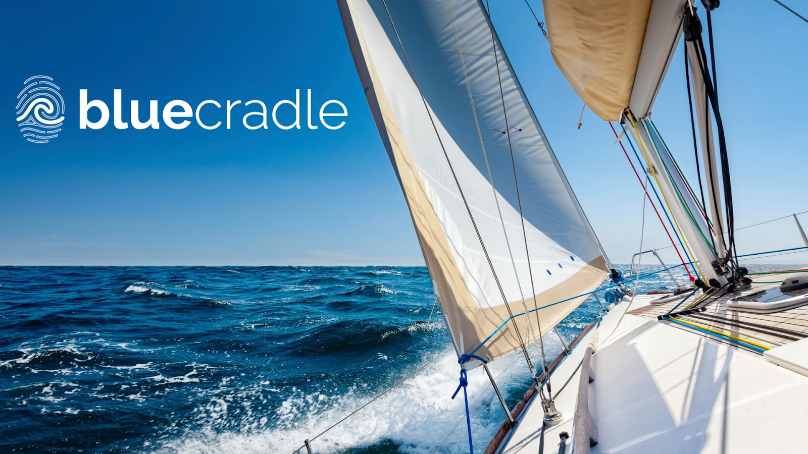 A sailboat on the ocean with the Blue Cradle logo
